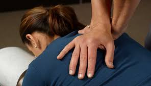 Chiropractor with patient